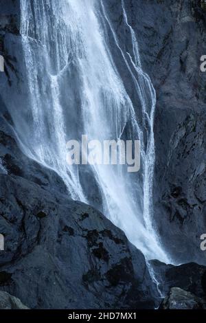 Aber Falls waterfall or Rhaeadr Fawr flowing water on dark rocks in Coedydd Aber Nature Reserve in Snowdonia. Abergwyngregyn Gwynedd Wales UK Stock Photo