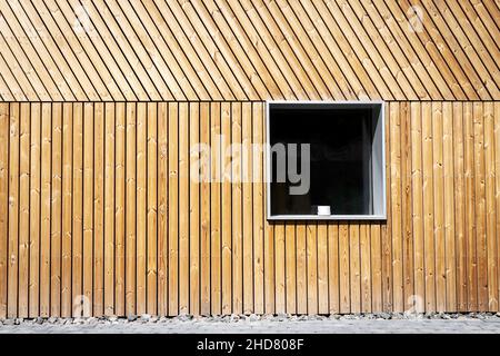 New vertical wooden plank wall with a window. Japanese style wooden wall pattern. Stock Photo