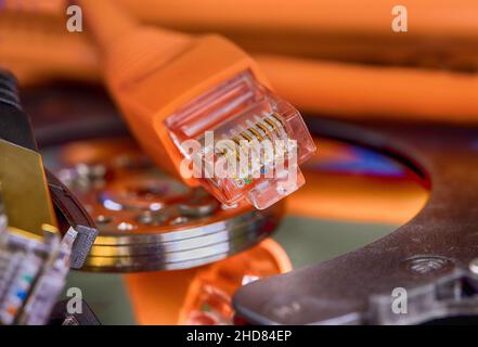Selective focus at internet network cables connected with online storage files backup Stock Photo