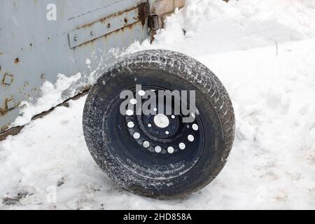 The wheel for the car is on the snow close up Stock Photo