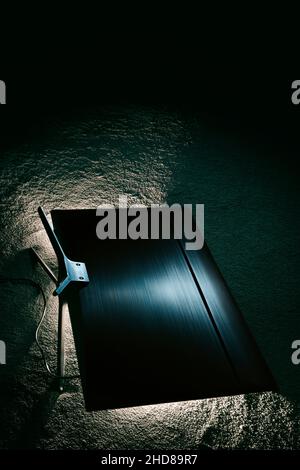 TV lying face down on the floor. Stock Photo