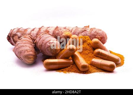 turmeric capsule, curcuma powder and tumeric rhizome,(Curcuma longa), isolated on white background. curcumina Stock Photo