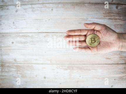 Businessman or woman holding bitcoin.Golden bitcoin coins in human hands. Virtual currency. Crypto currency. New virtual money. Opened wallet. copy Stock Photo