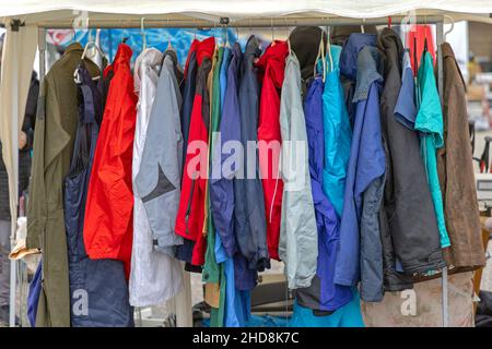Rain Coats Jackets Gear Clothing for Bad Weather Rack Stock Photo