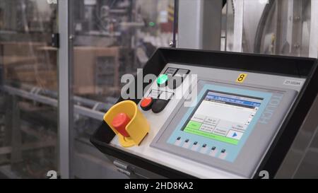 Control panel of automated packing machine in food production factory ...