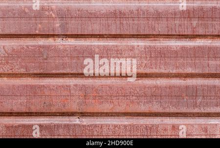 Rusty old iron corrugated metal sheet close up for background Stock Photo