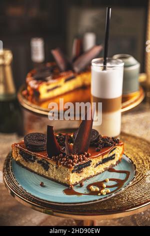 Cake with chocolate cookies and cream biscuits, salted caramel on the top Stock Photo