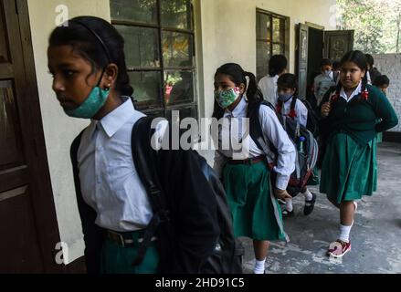 Students  in queue as they are waiting to get a vaccine against COVI-19,  during a vaccination drive for people in the 15-18 age group at a school in Guwahati, Assam, India on January 3, 2022. India has detected more than  1,700 cases of Omicron variant of novel coronavirus infection. Stock Photo