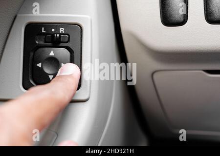 Adjusting side mirrors button (car electricity) Stock Photo