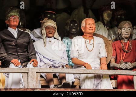 Effigies of dead people (Tau Tau) buried at the famous Londa burial caves, near Rantepao city. Londa, Rantepao, Toraja, South Sulawesi, Indonesia Stock Photo