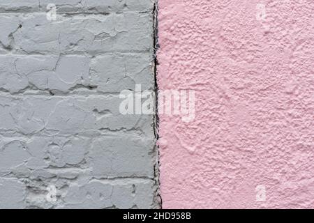 Close up of light pastel pink and grey brick painted wall texture background connected together. Stock Photo