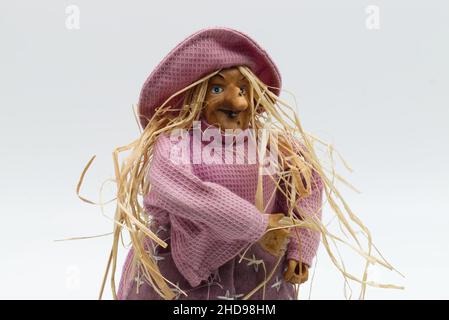 The Befana with yellow straw hair. Traditional witch costume for Italian Epiphany day. Stock Photo