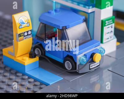 Tambov, Russian Federation - January 04, 2022 A blue Lego electric car charging at a charging station. Stock Photo
