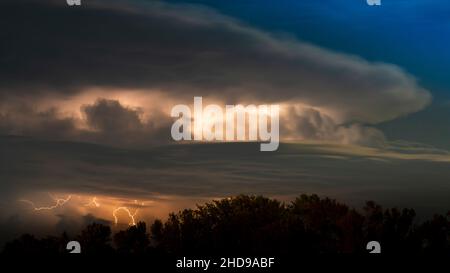 A thunder storm with lightning in the clouds south of Winkler, Maniotba, Canada. Stock Photo