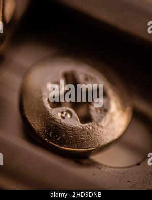 Macro shot of a bolt in the metal object Stock Photo