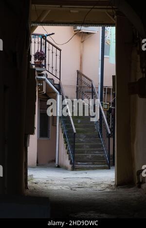 Old buildings of downtown of Baku. Old stair in narrow streets of the old city of Baku. Stock Photo