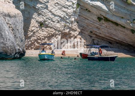 holiday makers and travellers exploring the caves ar keri on the greek ionian island of zante or zakynthos on summer holidays or vacations. Stock Photo