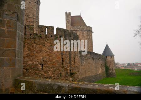 Crenellated ramparts and fortified walls of the walled city of Carcassonne in the French Occitanie region. Stock Photo