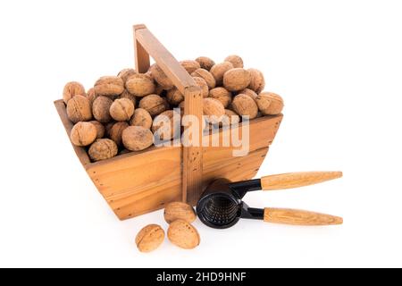 Wooden harvest baskets full walnuts isolated over white background Stock Photo