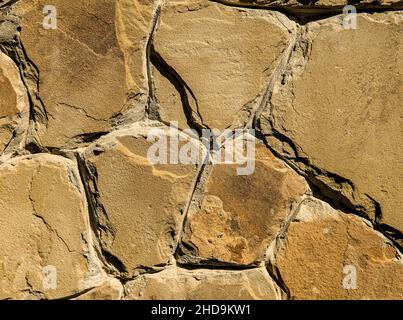 Stone wall texture. Background from natural neatly laid stone. Stock Photo