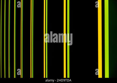 a black background with green and yellow neon vertical and parallel stripes 3d rendering Stock Photo