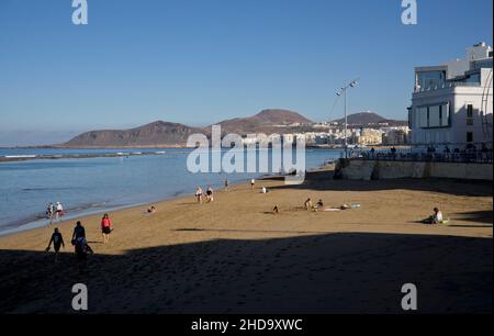 People swimming, playing sports, surfing, eating and drinking at Las Canteras beach in Las Palmas, Gran Canaria, Canary Islands,Spain Stock Photo