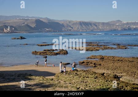 People swimming, playing sports, surfing, eating and drinking at Las Canteras beach in Las Palmas, Gran Canaria, Canary Islands,Spain Stock Photo