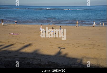 People swimming, playing sports, surfing, eating and drinking at Las Canteras beach in Las Palmas, Gran Canaria, Canary Islands,Spain Stock Photo