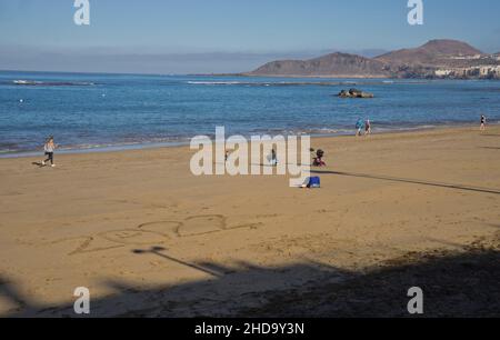 People swimming, playing sports, surfing, eating and drinking at Las Canteras beach in Las Palmas, Gran Canaria, Canary Islands,Spain Stock Photo