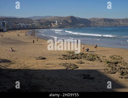 People swimming, playing sports, surfing, eating and drinking at Las Canteras beach in Las Palmas, Gran Canaria, Canary Islands,Spain Stock Photo