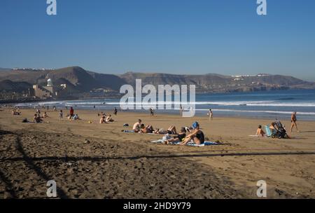 People swimming, playing sports, surfing, eating and drinking at Las Canteras beach in Las Palmas, Gran Canaria, Canary Islands,Spain Stock Photo