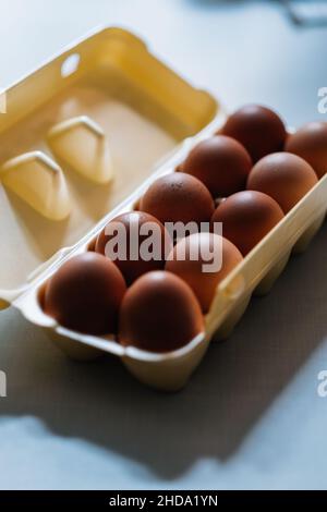 Closeup shot of an opened pack of eggs on a table Stock Photo