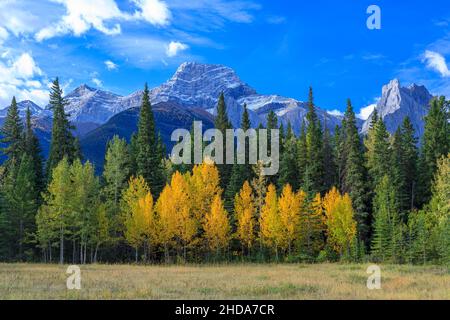 Mount Lougheed is a 3,107-metre (10,194-foot) triple-peak mountain located between Spray Lakes Reservoir and the Wind Valley of Kananaskis Country in Stock Photo