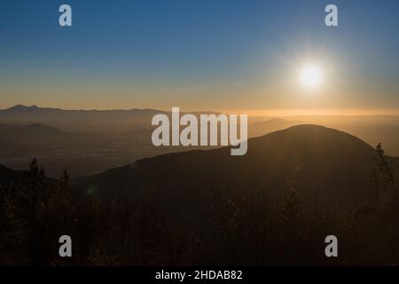 Setting sun above the San Bernardino and Los Angeles area as seen from above Stock Photo