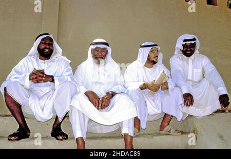 Four Arab Nationals passing the time in Al Ain, Abu Dhabi Emirate, UAE, circa 1984 Stock Photo
