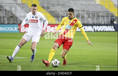 Florian Sotoca of Lens, Sven Botman of Lille (left) during the French Cup, round of 32, football match between RC Lens (RCL) and Lille OSC (LOSC) on January 4, 2022 at Stade Bollaert-Delelis in Lens, France - Photo: Jean Catuffe/DPPI/LiveMedia Stock Photo