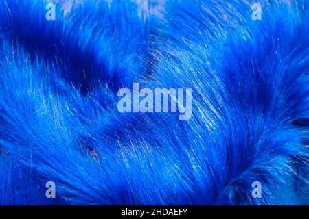 Furry fabric. Blue furry or shaggy or plush fabric in top view. Selective focus. Stock Photo
