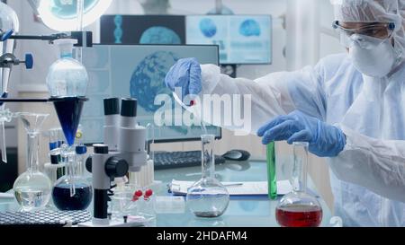 Microbiologist scientist doctor wearing ppe equipment working at ...