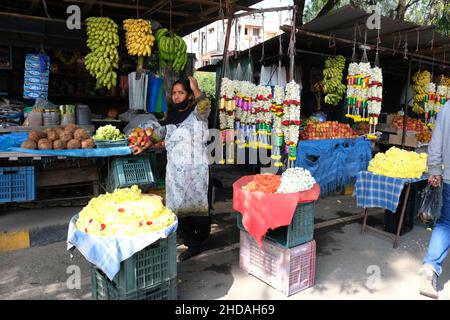 December 20, 2021, Colorful garlands flower selling in the market stalls in Karnataka, India, These flowers are used for wedding decorations, temple c Stock Photo