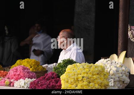 December 20, 2021, Colorful garlands flower selling in the market stalls in Karnataka, India, These flowers are used for wedding decorations, temple c Stock Photo