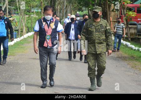 Bais, Philippines. 05th Jan, 2022. DPWH acting Secretary Roger G. Mercad, Lt. Gen. Robert C. Dauz PA Commander, Visayas Command, AFP with governor Governador Roel Ragay Degamo checked the devastation brought about by Typhoon Odette in Bais City. They conducted site visit and inspected the on-going joint clearing operations by LGU-DPWH. (currently undertaking massive clearing activities along Negros, Cebu and Bohol) (Photo by Joseph C. Ceriales/Pacific Press) Credit: Pacific Press Media Production Corp./Alamy Live News Stock Photo