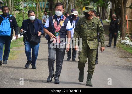 Bais, Philippines. 05th Jan, 2022. DPWH acting Secretary Roger G. Mercad, Lt. Gen. Robert C. Dauz PA Commander, Visayas Command, AFP with governor Governador Roel Ragay Degamo checked the devastation brought about by Typhoon Odette in Bais City. They conducted site visit and inspected the on-going joint clearing operations by LGU-DPWH. (currently undertaking massive clearing activities along Negros, Cebu and Bohol) (Photo by Joseph C. Ceriales/Pacific Press) Credit: Pacific Press Media Production Corp./Alamy Live News Stock Photo