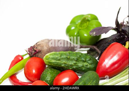 Vegetables cucumbers, tomatoes, beets, on a white background Stock Photo