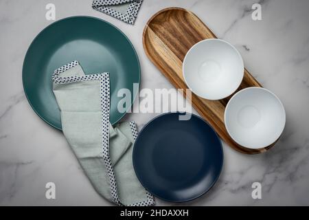 Top view of an arranged kitchen table with empty bowls Stock Photo
