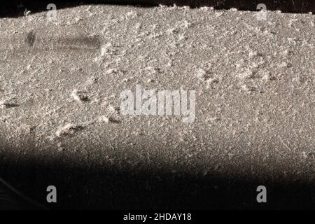 Dust on the floor. Dusty floor. Very dirty floor surface in sunlight. Uncleaned premises. The room in the house needs cleaning. Hard Floor Care. Clean Stock Photo