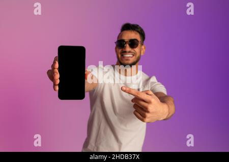 pleased muslim man in sunglasses relaxing in pool with refreshing cocktail  Stock Photo - Alamy