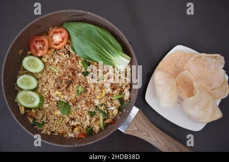 Very Delicious Fried Rice on A Teflon Serving With Crispy Crackers for Dinner Stock Photo