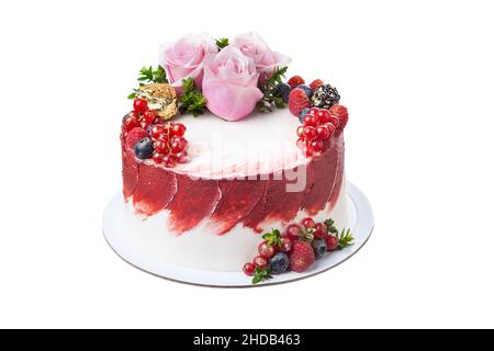Delicate summer fruit cake made from fruits, berries and rose flowers on a white isolated background. Stock Photo