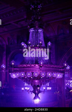 A chandelier is illuminated in purple in a music venue in Stockholm, Sweden. Stock Photo