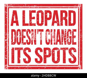 A LEOPARD DOESN'T CHANGE ITS SPOTS, written on red grungy stamp sign Stock Photo